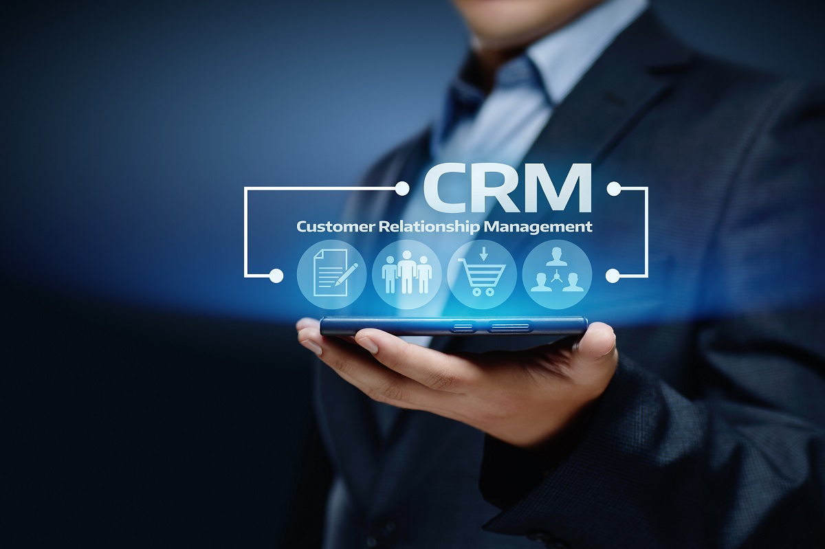 Man holding digital rendering of CRM